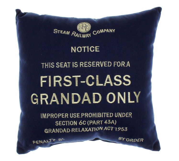 An image of a blue canvas railway cushion with cream embroidery stating, "this seat is reserved for a first class Grandad Only".