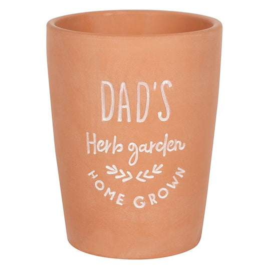 A great gardening gift for dads this herb garden plant pot is in a terracotta with a white font saying 'dad's herb garden' on the front.