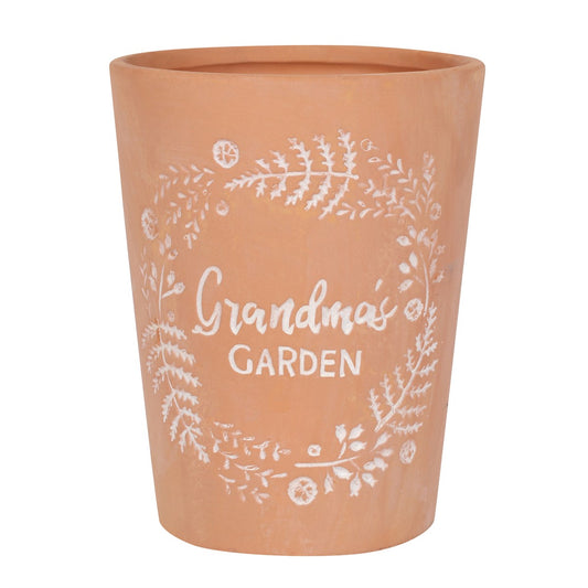 A terracotta plant pot with grandma's garden engraved on the front making the perfect grandmas gardening gift