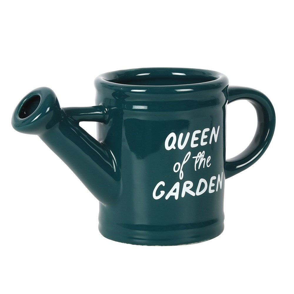 A dark green retro coffee mug in the shape of a watering can.