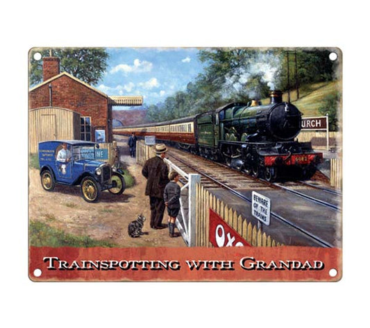 A small vintage railway sign on metal featuring a steam train and the words trainspotting with grandad.