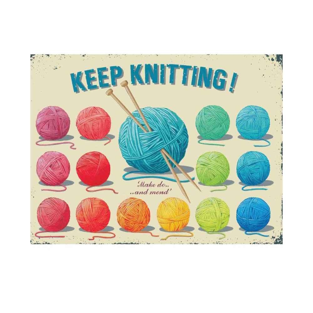 A vintage style metal sign saying 'Keep Knitting' referencing a WW2 saying with colourful balls of yarn.. 